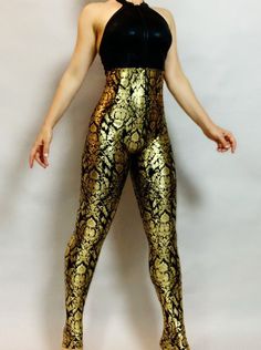 ..Elegant Royal Gold/black ooen back catsuit, costume for dancers, outfit for festival. Top- Black open back Bottom - high waisted pants (connected) Zipper front 4 way stretch Lycra fabric. Top quality gold metallic print and black hologram Lycra. Contact me if you like to switch top to the bottom fabrics or offer other fabric you like for this design. Get creative No extra charge for custom sizes or colors  . This beautiful costume is good for aerial shows, contortionist , acrobatic and dance competitions. Standard size or custom made by toys measurements is same price. Yes we make for man as well, most of our product is unisex.  Pick your size using this basic scale  XSmall: Fits women -men 85-105 lbs (and 5'4" tall and under) Small: Fits women- men 105 to 130 lbs Medium: Fits women - me Fitted Backless Leotard For Party, Fitted Backless Party Leotard, Stretch Dancewear Bodysuit For Costume Party, Gold Fitted Bodysuit For Club, Stretch Dancewear Bodysuit For Festivals, Full Length Stretch Unitard For Party, Fitted Full-length Unitard For Dance, High Stretch Full-length Party Jumpsuit Or Romper, Full Length High Stretch Jumpsuit For Parties