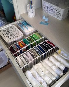 an organized drawer is shown with folded towels