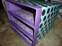 three tiered purple and blue desk with polka dots