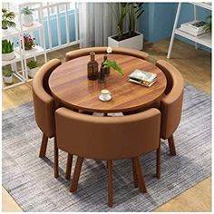 a round wooden table with four chairs around it