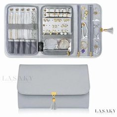 an open gray case with jewelry inside