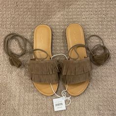 Double Fringe. Ankle Wrap With Tassels Casual Suede Lace-up Beach Sandals, Casual Suede Lace-up Sandals For Beach, Casual Brown Sandals With Tassels, Closed Toe Sandals With Tassels For Spring, Casual Closed Toe Sandals With Tassels, Casual Sandals With Tassels And Round Toe, Spring Flat Heel Sandals With Tassels, Flat Suede Sandals For Spring, Casual Open Toe Sandals With Tassels