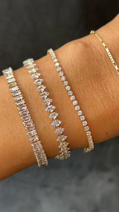 This timeless tennis bracelet was designed to fit seamlessly into your everyday stack- the petite stones shine in the light while the design remains subtle enough for everyday wear. Crafted with high-quality pavé stones that glimmer like real diamonds, this piece looks just like its expensive diamond counterpart. 14k Gold Plated with pavé stones Length: 6.25" + 2" Ext Please remove this piece prior to any water or sweat exposure, as the luster and shine of the stones will be compromised by water Bauble Bar Tennis Bracelet, Pandora Tennis Bracelet Stack, Classic Bracelets Women, Expensive Looking Jewelry, Elegant Bracelet Stack, Timeless Tennis Bracelet, Diamond Tennis Bracelet Stack, Luxury Bracelet Stack, Tennis Bracelet Stack