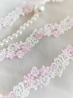 white and pink lace with pearls