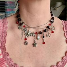 Elevate your Halloween ensemble with this unique upcycled Halloween necklace featuring a stunning combination of black and red beads. Adorned with exquisite vintage pendants, each piece exudes a touch of old-world charm. Crafted with durable stainless hardware, this Halloween necklace is not only stylish but also versatile. Perfect as a statement piece or as a thoughtful gift for her this Halloween, this necklace is sure to add an intriguing and spooky flair to any outfit. ✤length : 14 inch + 1 Black Vampire Pendant Jewelry, Black Vampire Style Pendant Jewelry, Spooky Black Necklace For Gift, Black Halloween Necklace With Lobster Clasp, Vampire Style Black Necklace For Halloween, Black Pendant Necklace For Halloween, Gothic Dangle Necklaces For Halloween, Gothic Beaded Necklaces For Halloween, Vintage Black Necklace For Halloween