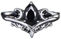 a black diamond ring with three stone accents