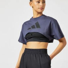 A Cropped-Tee For Post-Yoga Comfort. All Those Planks And Warrior Poses Are Paying Off. Show Off Your Hard-Earned Yoga Abs In This Adidas Crop Top. Pair It With A Favorite Pair Of High-Rise Tights, And Move Through The Day In Total Comfort. Our Cotton Products Support More Sustainable Cotton Farming. Loose Fit Ribbed Crewneck 100% Cotton Single Jersey Sleeve Pocket Cropped Length Single Jersey Supports The Better Cotton Initiative Color: Shadow Navy Do Not Bleach Do Not Tumble Dry Do Not Dry Cle Adidas Sporty Gym Tops, Adidas Activewear For Workout With Short Sleeves, Adidas Short Sleeve Activewear For Workout, Adidas Gym T-shirt With Short Sleeves, Adidas Cotton Sportswear Tops, Adidas Workout Activewear With Short Sleeves, Adidas Activewear For Workout, Sportswear Cropped T-shirt For Workout, Casual Adidas T-shirt For Gym