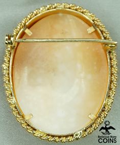 "Metal: 18k Yellow Gold (.750) Weight: 13.8 grams Measurements: 1.59\" Long; 1.2\" Wide; 0.52\" Deep Shell: Carnelian *Absolutely mesmerizing, this cameo brooch features a carnelian shell with a delicately hand-carved image of a woman facing left with a stunning floral headband set into a brilliant 18k yellow gold bezel. The outer border features a double twisted rows of gold. This outstanding brooch is in fantastic condition, with light wear. The roll over safety clasp works nicely. It appears Oval Carnelian Yellow Gold Jewelry, Formal Cameo Carnelian Jewelry, Formal Carnelian Cameo Jewelry, Formal Cameo Jewelry In Carnelian, Yellow Gold Carnelian Wedding Jewelry, Formal Gold Carnelian Jewelry, Gold Carnelian Jewelry For Wedding, Victorian Carnelian Jewelry For Formal Occasions, Cameo Carnelian Jewelry Gift