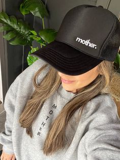 Simple and chic. This hat is for those who prefer a quieter, more minimalist style everyday hat. "mother" is embroidered in small white print on the left side of our premium trucker hat in Black. Feel strong and empowered while wearing this hat. Features: High profile, structured Color: Black "mother." embroidered in white Slightly curved visor "Strong as a mother" tag inside hat Foam trucker with nylon mesh back Plastic snapback We donate 10% of our proceeds to charitable organizations supporti Black Trucker Hat With Letter Print For Everyday, Trendy Black Trucker Hat For Everyday, Black Snapback Trucker Hat For Everyday, Everyday Black Snapback Trucker Hat, Everyday Trucker Hat With Curved Bill, Black Trucker Hat With Curved Visor For Everyday, Black Trucker Hat One Size Fits Most For Everyday, Black Everyday Trucker Hat One Size, Everyday Trucker Snapback Hat