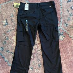 Women’s Dickies Stretch Cargo Pants Are Brand New & Have Never Been Worn.They Were Too Long For Me. Size 12, Black, Plenty Of Pockets On Legs & Back. They Are Sturdy With A Bit Of Stretch & These Fun & Trendy Pants Are Only Wrinkled From Storage. Fitted Black Work Pants With Pockets, Black Fitted Work Pants With Pockets, Stretch Black Work Pants With Pockets, Black Stretch Work Pants With Pockets, Black Utility Pants With Welt Pockets, Black Utility Bottoms With Welt Pockets, Fitted Bottoms With Multiple Pockets And Tapered Leg, Fitted Black Work Pants With Cargo Pockets, Fitted Black Cargo Work Pants