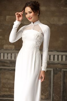 Modern raglan ao dai with 3D floral embellished – LAHAVA Ceremony Fitted Embellished Dress, Fitted Embellished Dresses For Ceremony, Embellished Fitted Dress For Ceremony, Elegant Ao Dai With Floral Embroidery, Long Sleeve Dresses With Floral Embroidery For Ceremony, Long Sleeve Floral Embroidery Dress For Ceremony, Ceremonial Ao Dai With Lace Sleeves, Elegant Ao Dai With Lace Sleeves For Wedding, Elegant Wedding Ao Dai With Lace Sleeves