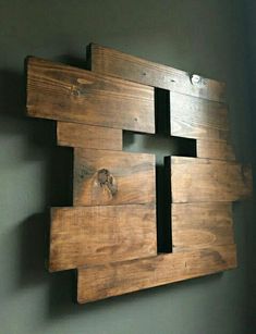 a piece of wood that has been made into a wall hanging on the side of a wall