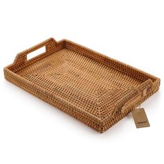 a brown wicker tray with a tag on it