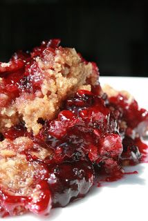 a white plate topped with cranberry cobbler cake