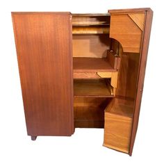 an open wooden cabinet with shelves and drawers