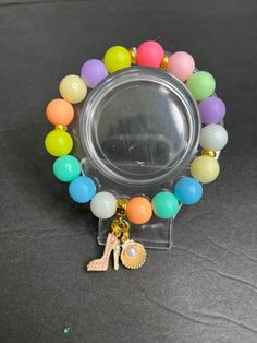 colorful  beaded bracelets with fun charms Colorful Beaded Bracelets, Bethlehem Pa, Barbie Stuff, Vert Olive, Bethlehem, Bubble Gum, Charm Bracelets, Handmade Bracelets, Gum