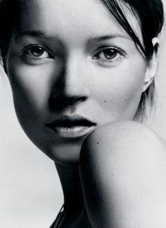 a black and white photo of a woman's face