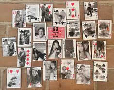 many playing cards have been placed on the wall to display photos and other things that are missing