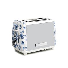 a white and blue flowered toaster on a white background