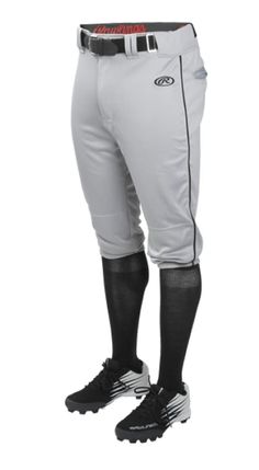 a baseball player in white pants and black socks