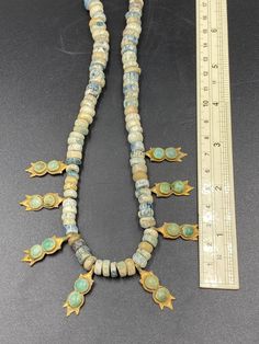 Amazing antique Roman glass beads with 20k gold and natural turquoise Gold Turquoise Necklace With Round Beads And Natural Stones, Handmade Gold Turquoise Necklace With Round Beads, Gold Turquoise Necklace With Polished Beads, Traditional Gold Beaded Necklaces With Natural Stones, Artisan Turquoise Necklace With Polished Gold Beads, Artisan Turquoise Necklace With Natural Stones In Gold, Artisan Gold Beaded Turquoise Necklace, Artisan Beaded Turquoise Necklace In Gold, Artisan Gold Turquoise Necklace With Natural Stones