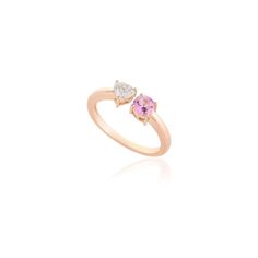 This is part of Chairish’s Fine Jewelry assortment.  Diamond Heart and Pink Sapphire Two Stone Open Ring in 18K Gold featuring natural pink sapphire of 0.38 carats and diamond of 0.34 carats. The gorgeous handcrafted ring goes with every style. Sapphire stimulates concentration and reduces stress. Designed with a heart cut diamond set on one side and round pink sapphire set on other side making a Toi et Moi ring that makes it a perfect fit to wear it on your occasion or style it with any of your Fine Jewelry Pink Sapphire Promise Ring, Fine Jewelry Pink Sapphire Diamond Ring In Pink Gold, Fine Jewelry Pink Gold Diamond Ring With Pink Sapphire, Pink Diamond Accented Promise Rings, Pink Diamond Ring With Diamond Accents For Promise, Pink Diamond Ring With Accents For Promise, Pink Diamond Accents Promise Rings, Pink Promise Diamond Ring With Accents, Pink Promise Rings With Diamond Accents