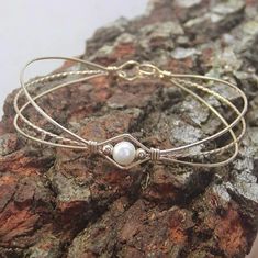 Pearl Bracelet Feminine Freshwater Pearl Gold Wire Bracelet | Etsy Wrapped Bracelets, Pearl Bracelet Wedding, Popular Bracelets, Wire Wrap Jewelry Designs, White Pearl Bracelet, Jewelry Staples, Wire Jewelry Tutorial, Pearl Bridal Jewelry, Wedding Bridesmaid Jewelry