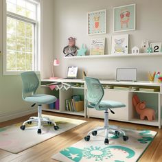 a child's room with two desks, chairs and rugs on the floor