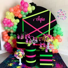 a decorated stage with balloons and decorations for a birthday or baby's first birthday