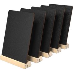 four black acoustic panels are lined up against each other