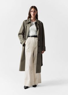 Collared single-breasted trenchcoat with a clean finish and a tonal self-tie belt. • Concealed button closures • Duo welt pockets • Buttoned tabs at the cuffs Length of coat: 116.5cm / 45.9" (Size S) Other Stories Coat, Jumpsuit And Blazer, Pull Oversize, Classic Blazer, Skirt Co Ord, Blazer Vest, Boot Pumps, Knitwear Cardigan, Fashion Story