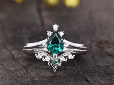 Pear shaped Emerald Rings,Unique Engagement Ring Set,Diamond Wedding Band,Curved Wedding Band,Women Promise Bridal Ring,vintage inspired,victorian jewelry Oval Emerald Engagement ring Set: https://www.etsy.com/listing/683456572/art-deco-emerald-engagement-ring Opal wedding ring set: https://www.etsy.com/listing/755472030/opal-engagement-ring-rose-gold ITEM DESCRIPTION Emerald Engagement Ring: ✦5x7mm Pear Cut Lab created emerald ✦0.07ctw round cut natural SI/H Diamonds or moissanite stones ✦Band Opal Wedding Ring Set, Emerald Engagement Ring Green, Emerald Engagement Ring Set, Emerald Ring Vintage, Diamond Bridal Ring Sets, Opal Wedding Rings, Diamond Wedding Rings Sets, Bridal Engagement Rings, Etsy Wedding Rings