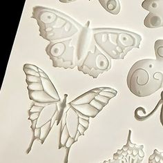 some butterflies and other things on a white sheet with the words butterfly's in it