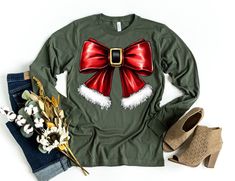 Christmas Coquette Christmas Sweatshirt, Christmas Bow Sweater, Holiday Crewneck, Cute Winter Sweatshirt, Women's Holiday Party Shirt, Xmas 📢Please Check All Photos For Details.   📢Choose Your T-Shirt Size From The Drop-Down Lists Next To The item Picture   📢Choose Of Your T-Shirt Color From The 2nd Picture   📢Use "Add message to Seller" link On The Checkout Page To Send me the Following important Details For Your Order's Customization.   📢Shipping Time Varies by location (we are located in Festive Long Sleeve T-shirt For Holiday, Festive Long Sleeve Holiday T-shirt, Festive Long Sleeve Tops For New Year, Holiday Long Sleeve Tops As Gifts, Holiday Long Sleeve Tops As A Gift, Green Long Sleeve Tops As Gift, Christmas Festive Long Sleeve Tops, Festive Long Sleeve Christmas T-shirt, Festive Long Sleeve Tops For Christmas