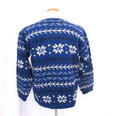 This beautiful Vintage Hand Knit Norwegian style fair isle sweater is in very good condition. No Tags. I knitted this in the 70's. Blue and white fair isle pattern. M-S. Chest 40 inches length from back of neck to bottom 24 inches sleeve length from shoulder to wrist 23 inches same pattern on the back. long sleeves 100% Pure Wool Dry Clean. I am happy to answer questions and combine postage. All items are from a smoke free pet free home. Winter Fair Isle Pattern Sweater For Cold Weather, Winter Fair Isle Sweater For Cold Weather, Blue Fair Isle Sweater For Cold Weather, Blue Wool Sweater With Fair Isle Pattern, Blue Nordic Sweater With Fair Isle Pattern, Blue Fair Isle Pattern Winter Sweater, Scandinavian Hand Knitted Winter Sweater, Scandinavian Hand-knitted Winter Sweater, Vintage Wool Sweater With Fair Isle Pattern