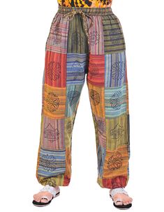 Get ready for some funky fresh fashion with our Square Patched Hand Printed Joggers. These one-of-a-kind joggers feature stylish square patches and a hand-printed design, making them a unique addition to any wardrobe. Comfortable and cool, these joggers are perfect for everyday wear with a touch of flair. Grab a pair now and stand out in style! Multicolor Patchwork Pants For Loungewear, Casual Multicolor Harem Pants With Elastic Waistband, Multicolor Cotton Relaxed Fit Sweatpants, Multicolor Relaxed Fit Cotton Sweatpants, Multicolor Patchwork Bottoms For Loungewear, Multicolor Cotton Sweatpants For Spring, Comfortable Multicolor Cotton Bottoms, Casual Festival Pants With Patchwork, Multicolor Relaxed Fit Sweatpants