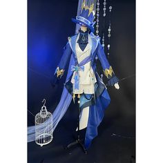 a mannequin dressed in blue and white with a birdcage hanging from it's side