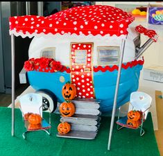 a camper decorated with pumpkins and jack - o'- lanterns