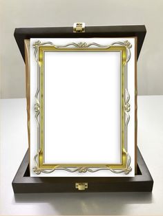 a black and gold frame sitting on top of a table