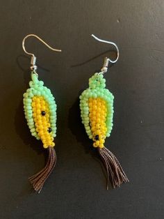 "Hand-beaded, these earrings are designed to look like fresh corn in shades of green, yellow and brown and there are \"corn silk\" tassels on the ends. They hang 2.5\" from stainless wires. 26-763" Corn Design, Corn Silk, Indian Corn, Silk Tassels, Orange Tabby Cats, Orange Tabby, Fresh Corn, Bead Jewellery, Yellow And Brown