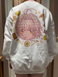 Cardcaptor Sakura sweater, printed with Sakura design on the back and small Kero on the front. Everything is printed on my Brother GT3, please wash inside out to protect the print quality! 💖 please be aware shipping my take up to a week if I need to order more sizes in, otherwise shipped out same/next day ☺️ Cardcaptor Sakura Clothes, Sakura Clothes, Sakura Design, Yume Kawaii, Clothes Art, Practical Fashion, Fashion Top Outfits, Cute Dress Outfits, Sakura Card