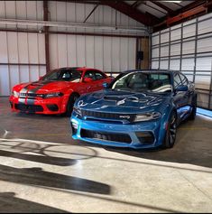 two cars parked in a garage next to each other