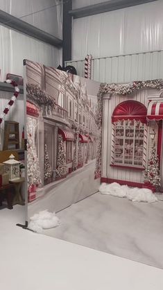 a photo booth set up with red and white decorations