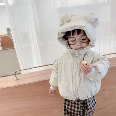 Introducing our Hooded Puffer Bear Jacket, the perfect blend of warmth, style, and cuteness for your little ones. This jacket is not just a winter essential; it's a delightful fashion statement that will make your child the star of any outing. The standout feature is the lovable bear design on the hood, complete with fuzzy bear ears, adding an element of charm that kids adore. Cute Outerwear With Fleece Lining For Winter, Cute Winter Outerwear With Fleece Lining, Cute Hooded Outerwear, Playful Hooded Outerwear For Playtime, Playful Hooded Outerwear For Cold Weather, Cute Winter Outerwear With Adjustable Hood, Cute Outerwear With Fleece Lining For Cold Weather, Cute Winter Hooded Jacket, Playful Hooded Winter Outerwear