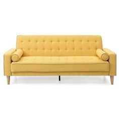 a yellow couch sitting on top of a white floor