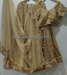 Indian wedding lehenga with embroidered blouse & dupatta for women. * Plus size available at a small up-charge. * Size: This is custom made outfit as per your size. Post your order we will send you a measurements reference sheet using which you can provide details required to make your outfit with best fit. * Fabric and work: Lehenga - Antique gold sequine fabric with very good quality lining and lace border. Blouse - Sequins fabric. Dupatta - Dupatta is in gold net with embroidery lace border o Gold Saree Dress With Mirror Work, Semi-stitched Gold Embroidered Sharara For Party, Semi-stitched Sharara With Gold Embroidery For Party, Party Semi-stitched Sharara With Gold Embroidery, Bollywood Style Gold Sequin Dress, Gold Bollywood Dress With Sequins, Gold Sequin Dress For Diwali, Gold Sequined Sharara For Party Wear, Gold Chinon Sharara For Party