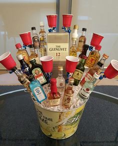 a bucket filled with lots of liquor bottles