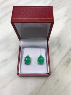 Featured here is a magnificent set of 8.50 total carat weight, cabochon-cut emerald & diamond studs in fine 14K yellow gold. Displayed are medium-green emeralds with very good transparency, accented by brilliant round diamonds in a simple four-prong gold mount, allowing for the emerald to be shown in full view. The earth mined, green emeralds have a desirable lush green color with excellent qualities. These earrings are ideal for everyday use and are the perfect accessory to any outfit. Emer Formal Fine Jewelry Gemstone Cabochons, Luxury Cabochon Drop Earrings, Luxury Oval Cabochon Gemstone Earrings, Luxury Diamond Earrings With Cabochon, Luxury Diamond Cabochon Earrings, Elegant Pear-shaped Gemstones For Formal Occasions, Fine Jewelry Cabochon Gemstones For Formal Occasions, Luxury Round Cabochon Earrings, Formal Fine Jewelry Cabochon Gemstones