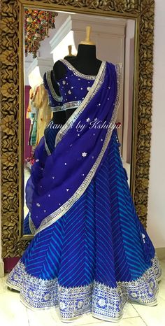 Designer Blue Leheriya Lehenga Set.  Product Highlights for Designer Blue Leheriya Lehenga Set: Fabric: Pure georgette, pure raw silk and pure organza Color: Blue Embroidery: Gota patti and Zardozi Ships in 4 weeks  Length of Lehenga 43 inch Length of Dupatta 2.75 meters Free Service: The outfit comes stitched ready to wear with bottom. It has handmade latkans wherever needed. The dupatta is well finished from all four sides with backing. Any Questions? You can message/whatsapp us at: 7023953082. Leheriya Lehenga, Handmade Latkans, Gota Patti Lehenga, Bandhani Lehenga, Lehnga Dress, Designer Bridal Lehenga, Blue Lehenga, Half Saree Designs, Indian Dresses Traditional