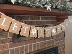 a mantle with a sign that says let it snow